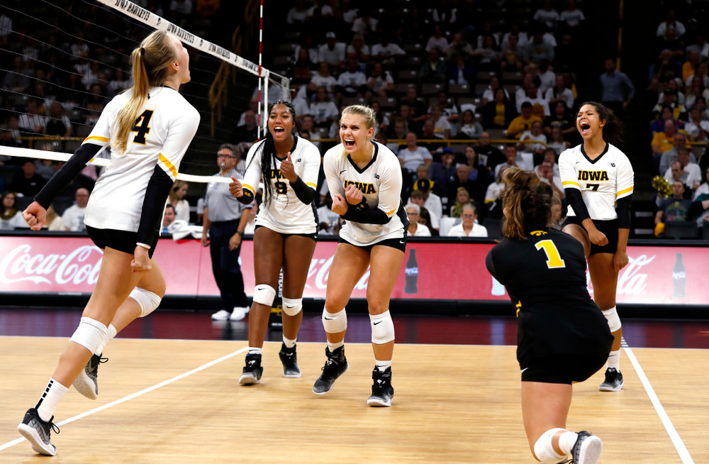 Iowa Hawkeyes right side hitter Reghan Coyle (8) and middle blocker Amiya Jones (9) against the Michigan State Spartans Friday, September 21, 2018 at Carver-Hawkeye Arena. (Brian Ray/hawkeyesports.com)