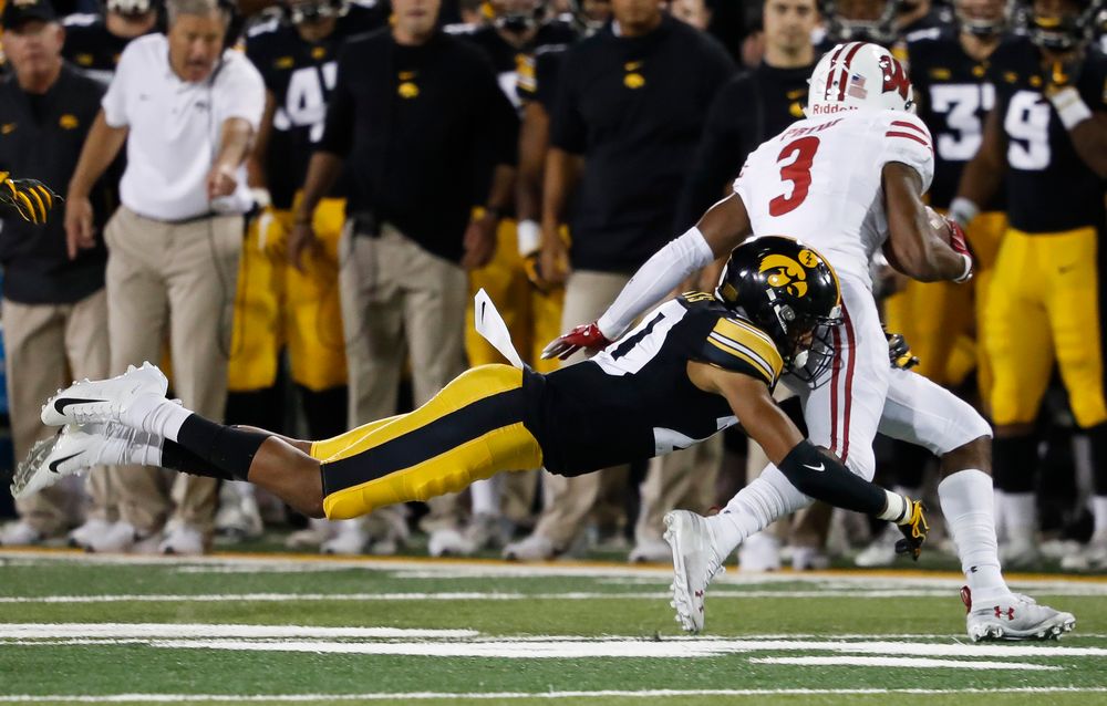 Iowa Hawkeyes defensive back Julius Brents (20) makes a tackle during a game against Wisconsin at Kinnick Stadium on September 22, 2018. (Tork Mason/hawkeyesports.com)