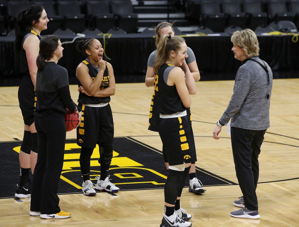 Iowa Hawkeyes forward Megan Gustafson (10), guard Tania Davis (11), guard Makenzie Meyer (3), guard Kathleen Doyle (22), and head coach Lisa Bluder share a laugh at a practice during the 2019 NCAA Women's Basketball Tournament at Carver Hawkeye Arena in Iowa City on Saturday, Mar. 23, 2019. (Stephen Mally for hawkeyesports.com)
