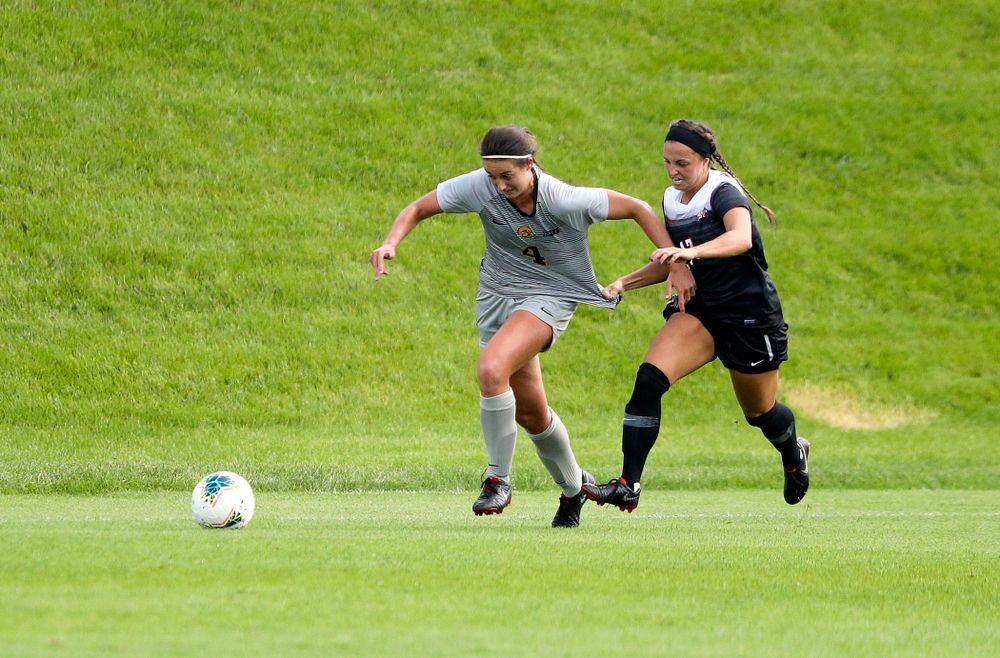 Iowa forward Kaleigh Haus (4) tries to pull away from a defender during the first half of their match at the Iowa Soccer Complex in Iowa City on Sunday, Sep 1, 2019. (Stephen Mally/hawkeyesports.com)