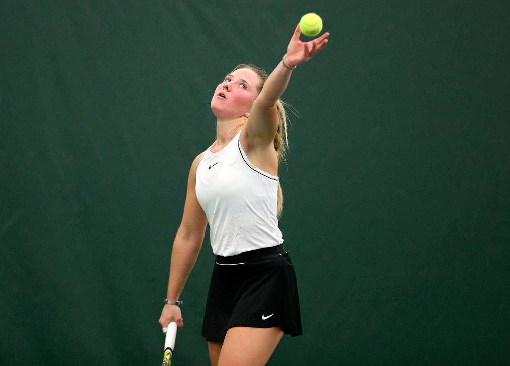 Iowa’s Danielle Burich serves during her singles match at the Hawkeye Tennis and Recreation Complex in Iowa City on Sunday, February 16, 2020. (Stephen Mally/hawkeyesports.com)