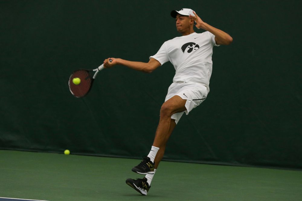 Iowa’s Oliver Okonkwo hits a forehand during the Iowa men’s tennis match vs Western Michigan on Saturday, January 18, 2020 at the Hawkeye Tennis and Recreation Complex. (Lily Smith/hawkeyesports.com)