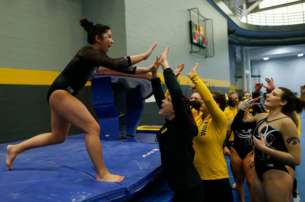 Nicole Chow celebrates after competing on the vault during the Black and Gold Intrasquad meet at the Field House on 12/2/17. (Tork Mason/hawkeyesports.com)