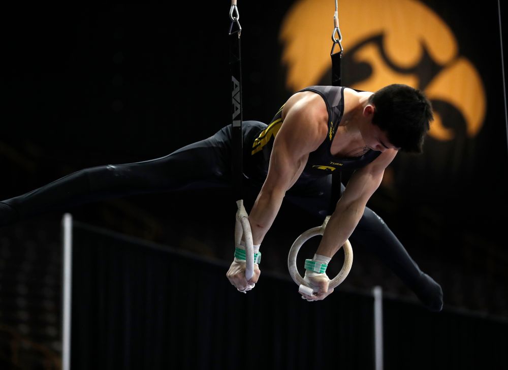 Addison Chung competes on the rings against Minnesota and Air Force 