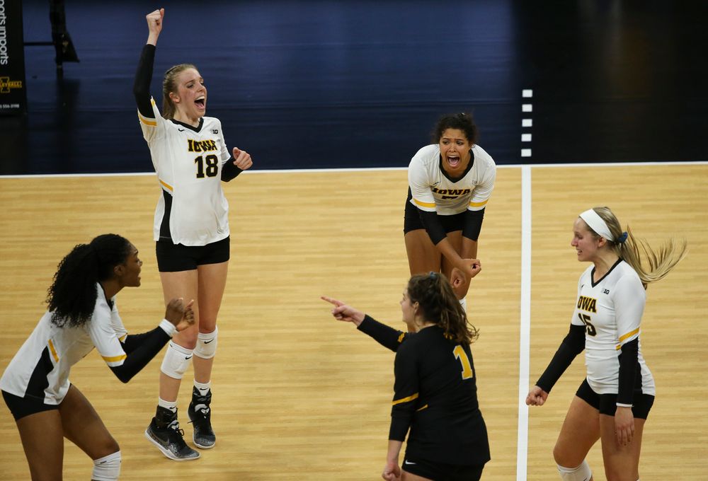 Iowa Hawkeyes middle blocker Hannah Clayton (18) and Iowa Hawkeyes setter Brie Orr (7) react after winning a point during a game against Purdue at Carver-Hawkeye Arena on October 13, 2018. (Tork Mason/hawkeyesports.com)