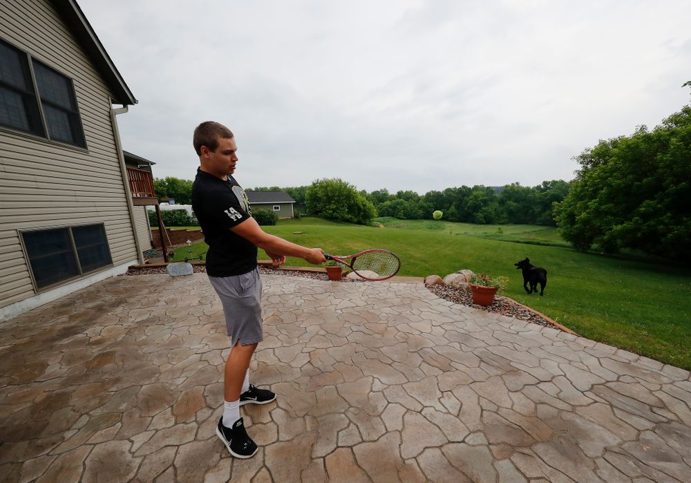 Iowa Hawkeyes quarterback Nathan Stanley (4) plays with his dog Onyx at his home Wednesday, May 30, 2018 in Menomonie, Wisc. (Brian Ray/hawkeyesports.com)