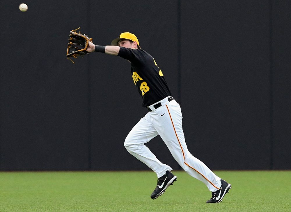 Iowa Hawkeyes left fielder Chris Whelan (28) makes a running catch for an out during the third inning of their game against Western Illinois at Duane Banks Field in Iowa City on Wednesday, May. 1, 2019. (Stephen Mally/hawkeyesports.com)