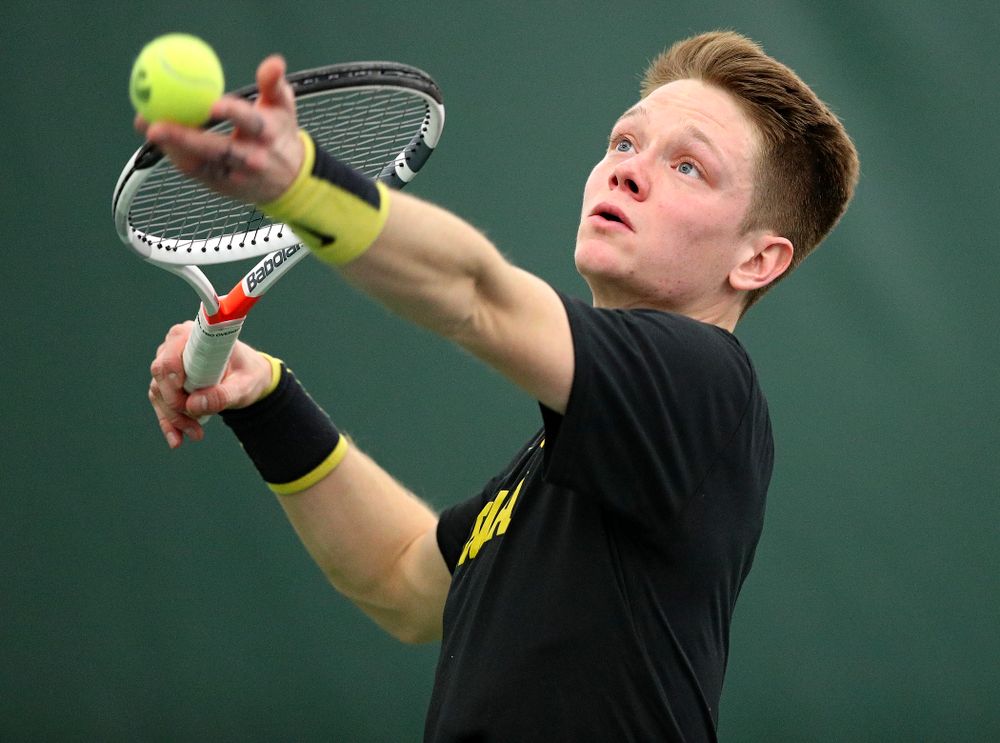 Iowa’s Jason Kerst serves during his singles match at the Hawkeye Tennis and Recreation Complex in Iowa City on Friday, February 14, 2020. (Stephen Mally/hawkeyesports.com)