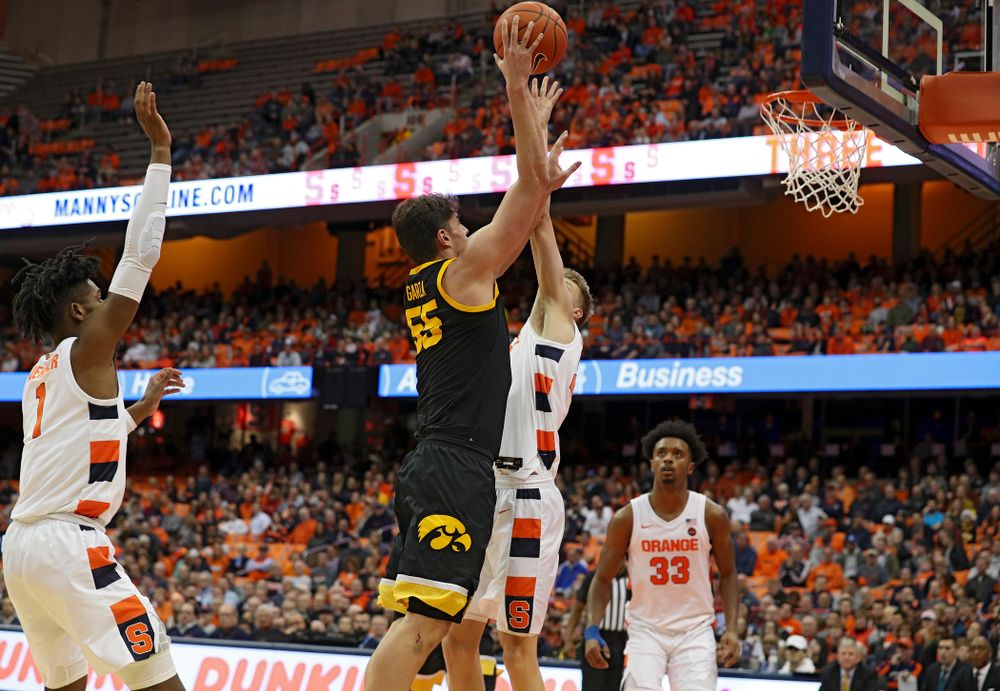 Iowa Hawkeyes center Luka Garza (55) makes a basket during the second half of their ACC/Big Ten Challenge game at the Carrier Dome in Syracuse, N.Y. on Tuesday, Dec 3, 2019. (Stephen Mally/hawkeyesports.com)