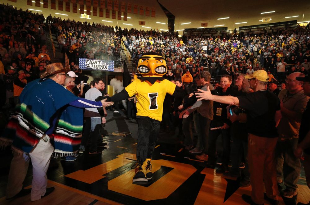 Herky runs through the alumni tunnel before the Iowa Hawkeyes meet against Oklahoma State’s at pounds Sunday, February 23, 2020 at Carver-Hawkeye Arena. (Brian Ray/hawkeyesports.com)