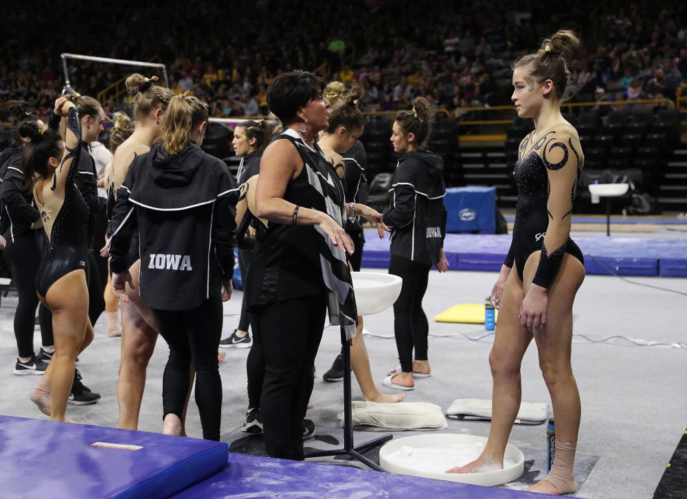 Iowa assistant coach Jennifer Green talks with Mackienzie Vance before her beam routine during their meet against Southeast Missouri State Friday, January 11, 2019 at Carver-Hawkeye Arena. (Brian Ray/hawkeyesports.com)