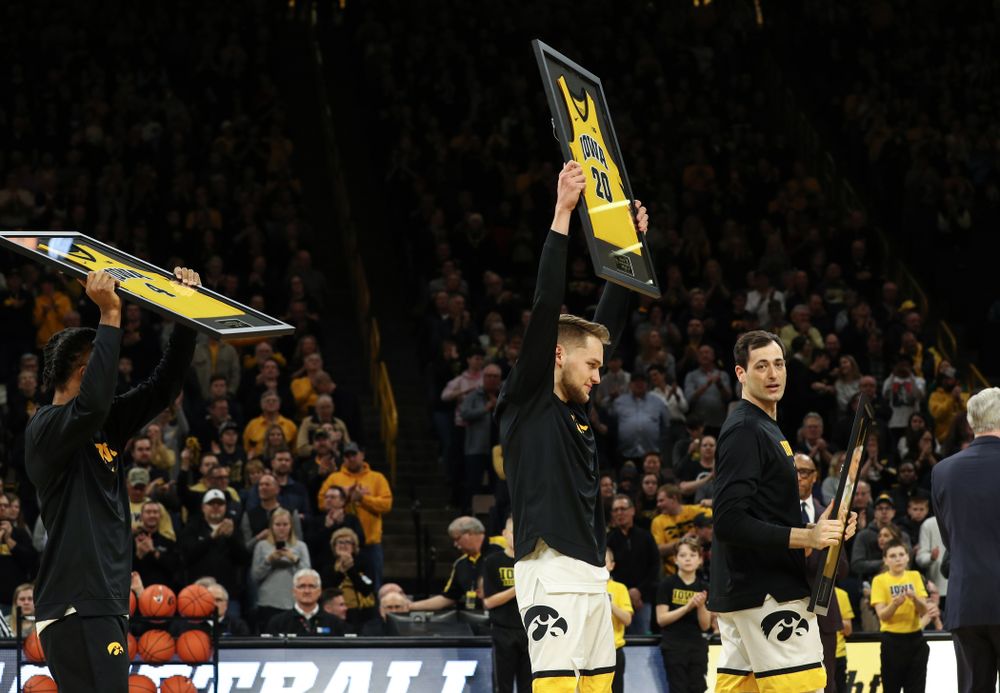 Iowa Hawkeyes forward Riley Till (20) holds up his jersey during senior night activities before their game against the Purdue Boilermakers Tuesday, March 3, 2020 at Carver-Hawkeye Arena. (Brian Ray/hawkeyesports.com)