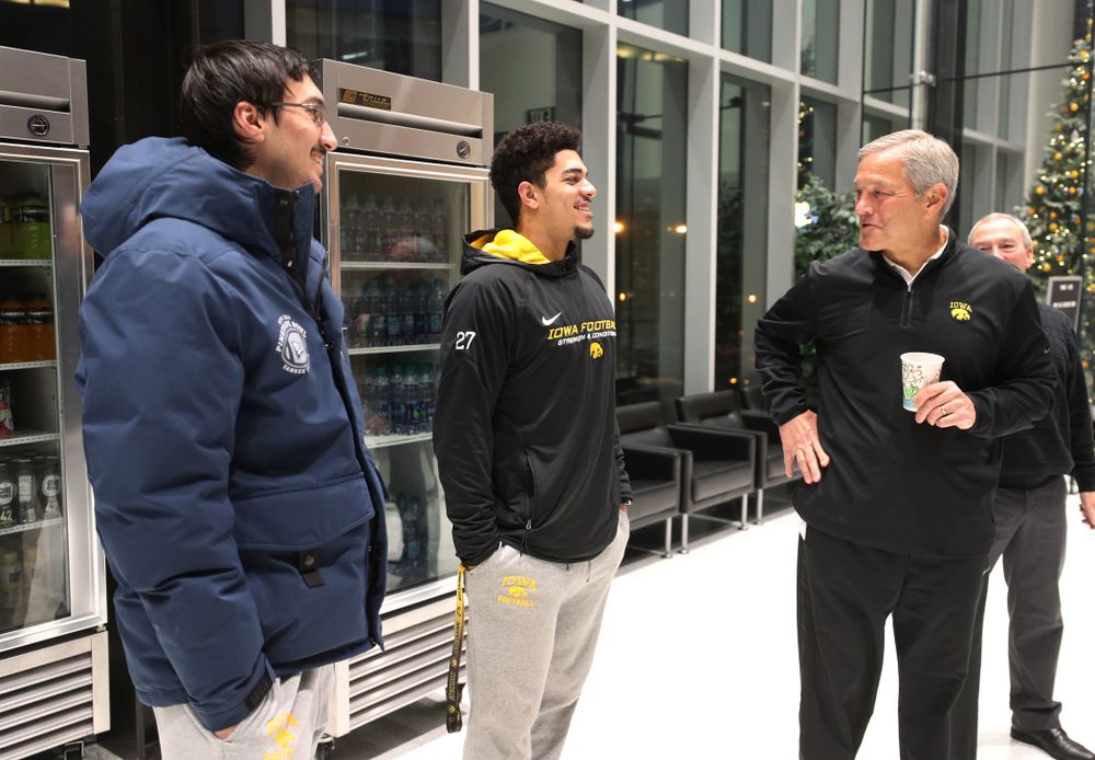 Iowa Hawkeyes head coach Kirk Ferentz talks with place kicker Miguel Recinos (91) and defensive back Amani Hooker (27) about the Hawkeyes selection to face Mississippi State in the Outback Bowl Sunday, December 2, 2018 at the Hansen Football Performance Center. (Brian Ray/hawkeyesports.com)