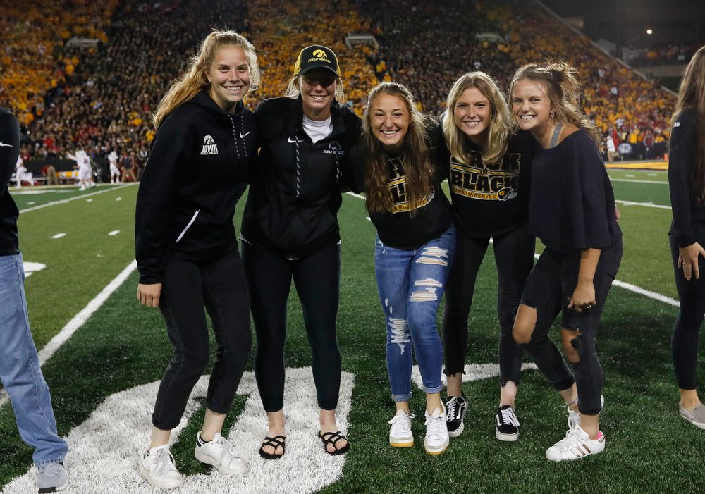 Members of the Iowa field hockey team are recognized by the Presidential Committee on Athletics at halftime during a game against Wisconsin on September 22, 2018. (Tork Mason/hawkeyesports.com)