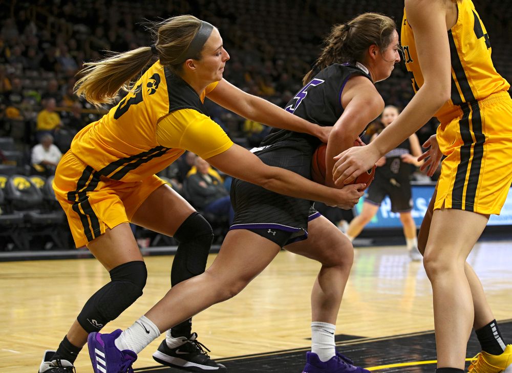 Iowa guard Makenzie Meyer (3) keeps her hands on a tied ball during the fourth quarter of their game against Winona State at Carver-Hawkeye Arena in Iowa City on Sunday, Nov 3, 2019. (Stephen Mally/hawkeyesports.com)