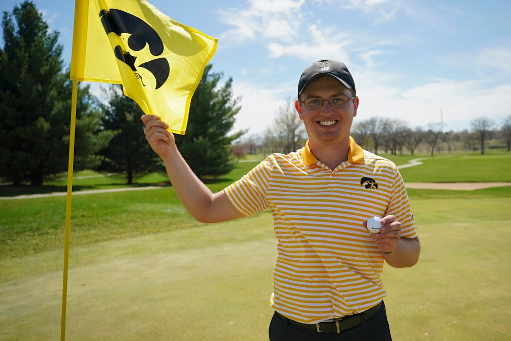 Iowa's Matthew Walker holds up the ball he used for a hole-in-one on the fourth hole during the third round of the Hawkeye Invitational at Finkbine Golf Course in Iowa City on Sunday, Apr. 21, 2019. (Stephen Mally/hawkeyesports.com)