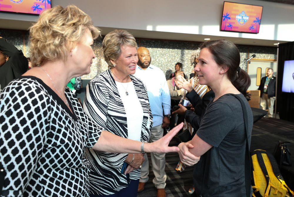 Iowa Hawkeyes head coach Lisa Bluder and director of basketball operations Kathryn Reynolds talk with  Ann Meyers Drysdale following a news conference Thursday, April 4, 2019 at Amalie Arena in Tampa, FL. (Brian Ray/hawkeyesports.com)
