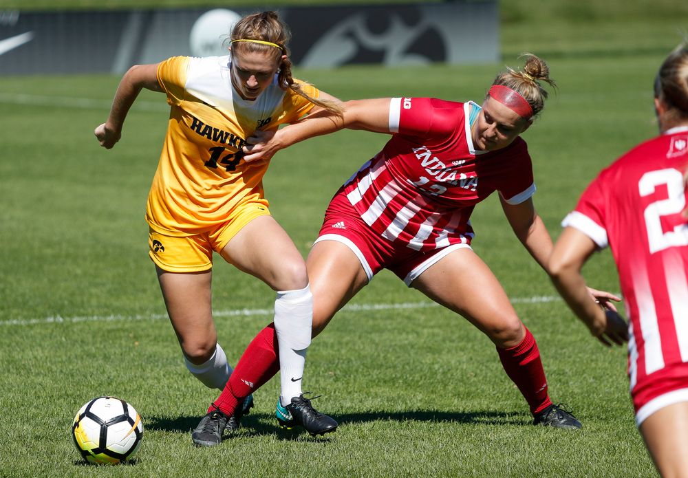 Iowa Hawkeyes defender Leah Moss (14) battles for possession during a game against Indiana at the Iowa Soccer Complex on September 23, 2018. (Tork Mason/hawkeyesports.com)