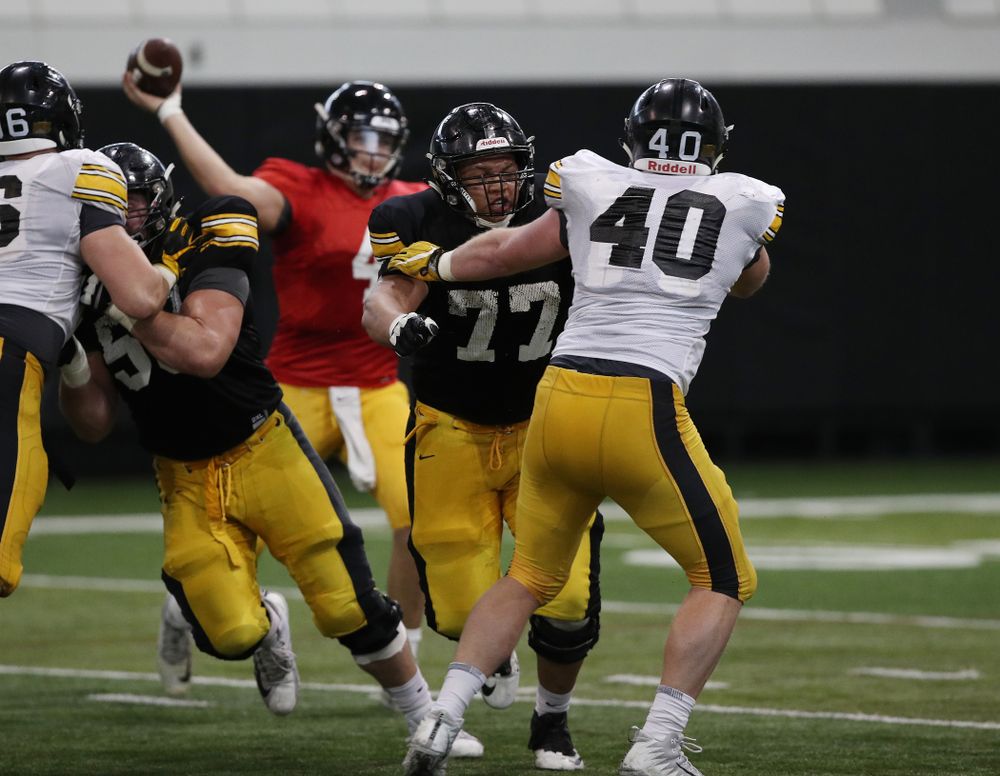 Iowa Hawkeyes offensive lineman Alaric Jackson (77) and defensive end Parker Hesse (40) during preparation for the 2019 Outback Bowl Wednesday, December 19, 2018 at the Hansen Football Performance Center. (Brian Ray/hawkeyesports.com)