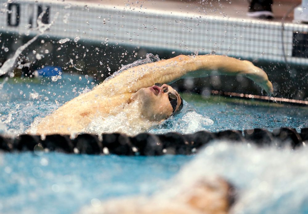 Iowa's Kenneth Mende swims the 100 yard backstroke  