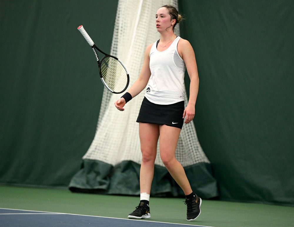 Iowa’s Samantha Mannix flips her racket during her singles match at the Hawkeye Tennis and Recreation Complex in Iowa City on Sunday, February 23, 2020. (Stephen Mally/hawkeyesports.com)