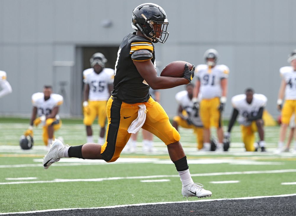 Iowa Hawkeyes running back Ivory Kelly-Martin (21) scores a touchdown during Fall Camp Practice No. 11 at the Hansen Football Performance Center in Iowa City on Wednesday, Aug 14, 2019. (Stephen Mally/hawkeyesports.com)