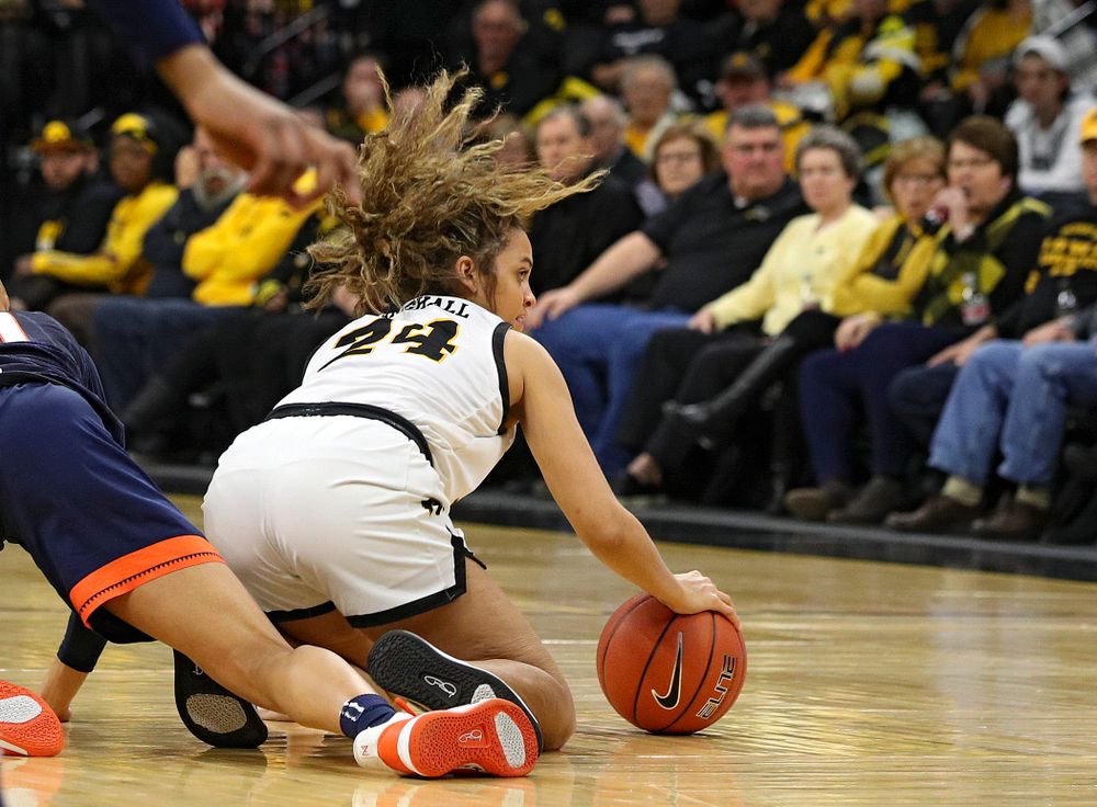 Iowa Hawkeyes guard Gabbie Marshall (24) grabs a loose ball on the court during the second quarter of their game at Carver-Hawkeye Arena in Iowa City on Tuesday, December 31, 2019. (Stephen Mally/hawkeyesports.com)