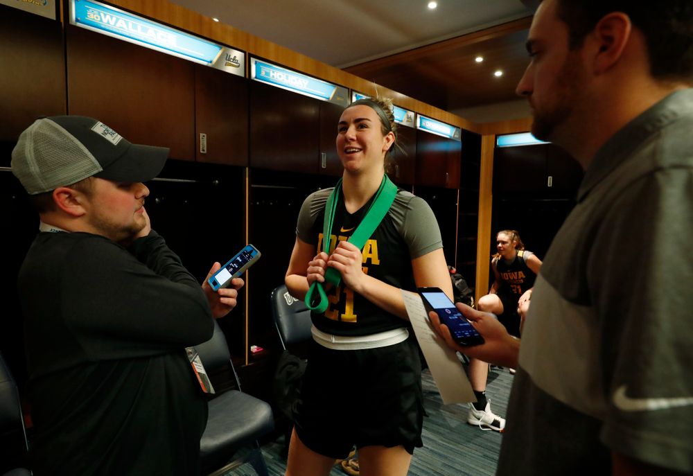 Iowa Hawkeyes forward Hannah Stewart (21) answers questions before practice Friday, March 16, 2018 at Pauley Pavilion on the campus of UCLA. (Brian Ray/hawkeyesports.com)