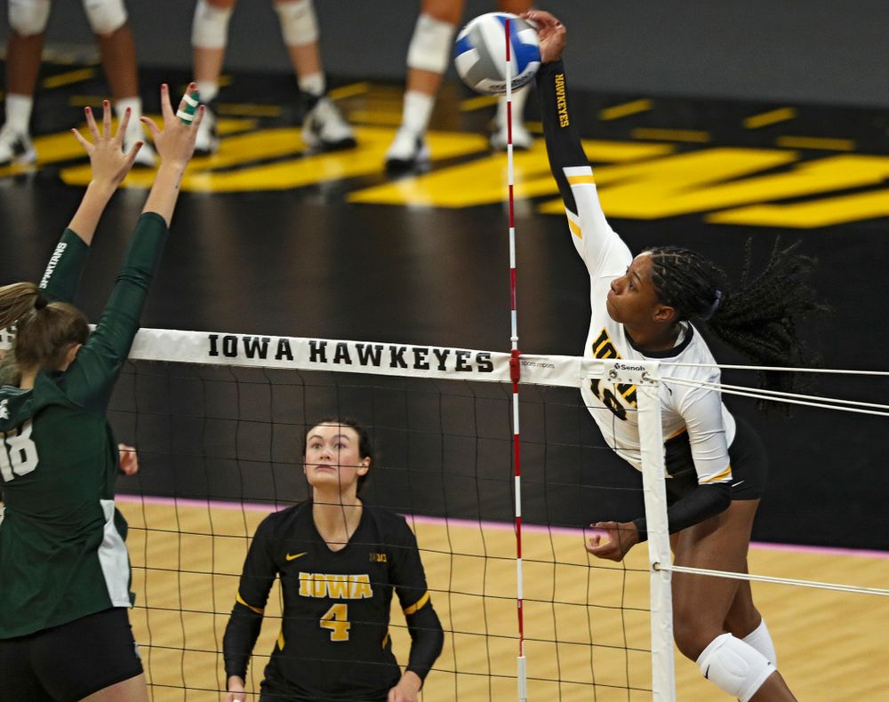 Iowa’s Griere Hughes (10) gets a kill during the first set of their volleyball match at Carver-Hawkeye Arena in Iowa City on Sunday, Oct 13, 2019. (Stephen Mally/hawkeyesports.com)