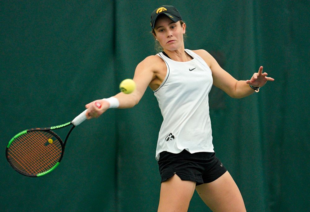 Iowa’s Elise Van Heuvelen returns a shot during her doubles match at the Hawkeye Tennis and Recreation Complex in Iowa City on Sunday, February 16, 2020. (Stephen Mally/hawkeyesports.com)