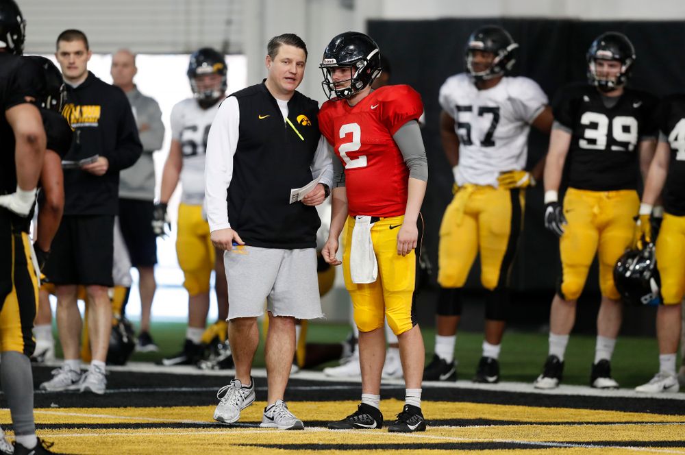Iowa Hawkeyes offensive coordinator Brian Ferentz and quarterback Peyton Mansell (2) during spring practice Wednesday, March 28, 2018 at the Hansen Football Performance Center.  (Brian Ray/hawkeyesports.com)