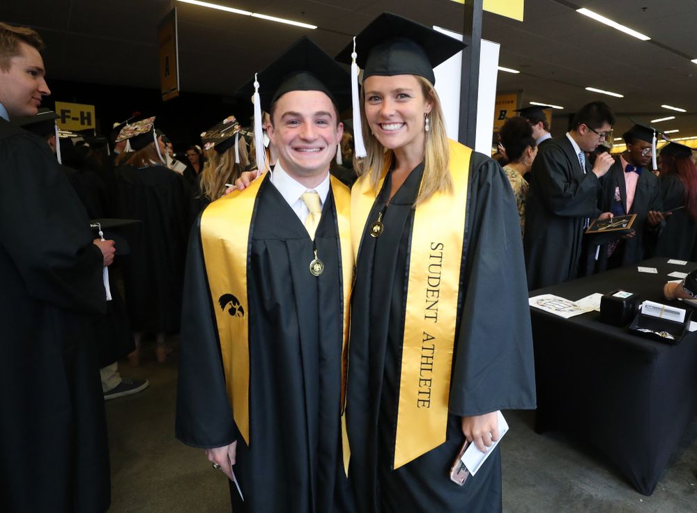 Gymnasts Jake Brodarzon and Sydney Hogan during the College of Liberal Arts and Sciences spring commencement Saturday, May 11, 2019 at Carver-Hawkeye Arena. (Brian Ray/hawkeyesports.com)