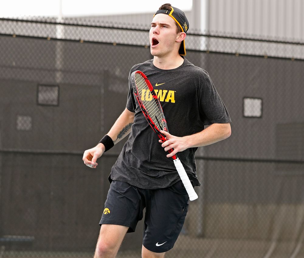 Iowa's Jonas Larsen celebrates a point as he competes during a match against Ohio State at the Hawkeye Tennis and Recreation Complex in Iowa City on Sunday, Apr. 7, 2019. (Stephen Mally/hawkeyesports.com)