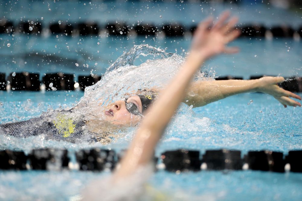 IowaÕs Emily Sansome swims the 100 yard backstroke against the Michigan Wolverines Friday, November 1, 2019 at the Campus Recreation and Wellness Center. (Brian Ray/hawkeyesports.com)