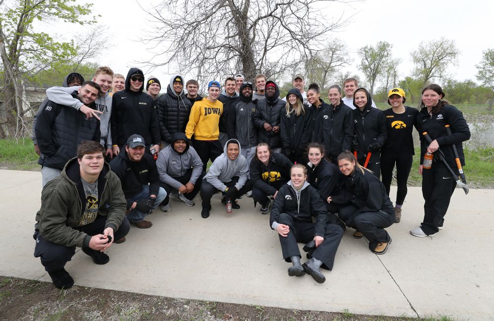 Members of the Hawkeye Football and Soccer teams volunteer with the Iowa City Public Works department along the Iowa River during the annual Iowa Athletics Day of Caring  Sunday, April 28, 2019 in Iowa City. (Brian Ray/hawkeyesports.com)
