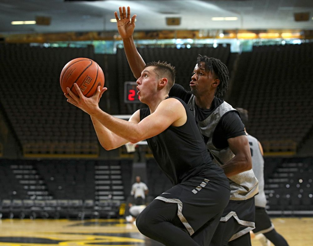 Iowa Hawkeyes guard CJ Fredrick (5) drives to the basket as guard Bakari Evelyn (4) defends during practice at Carver-Hawkeye Arena in Iowa City on Monday, Sep 30, 2019. (Stephen Mally/hawkeyesports.com)