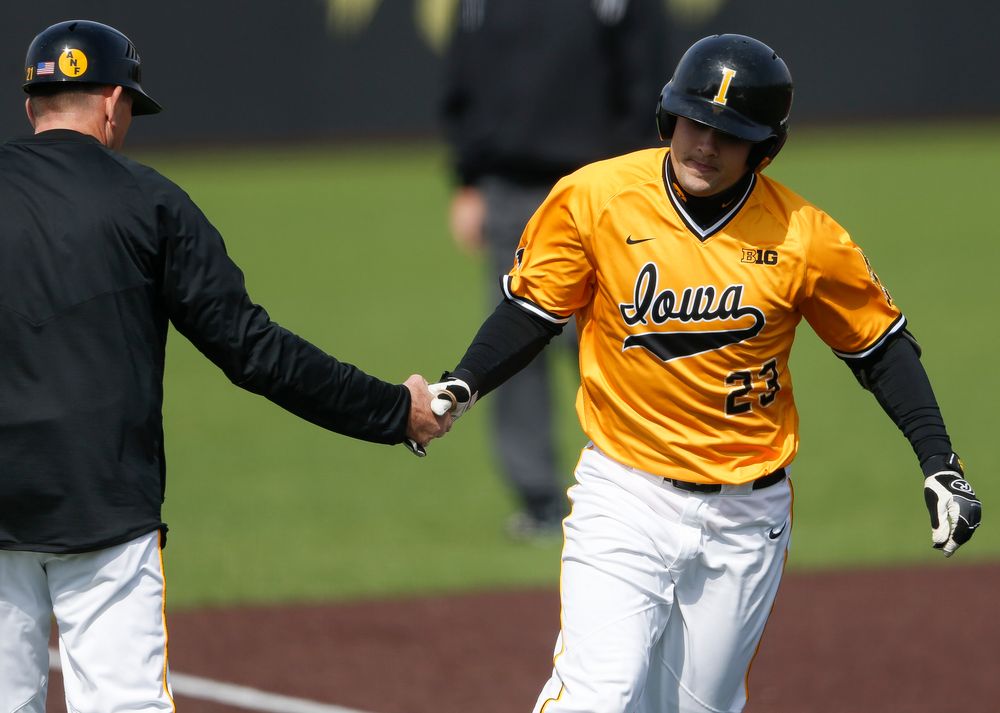 Iowa Hawkeyes infielder Kyle Crowl (23) rounds third base after hitting a home run during a game against Evansville at Duane Banks Field on March 18, 2018. (Tork Mason/hawkeyesports.com)