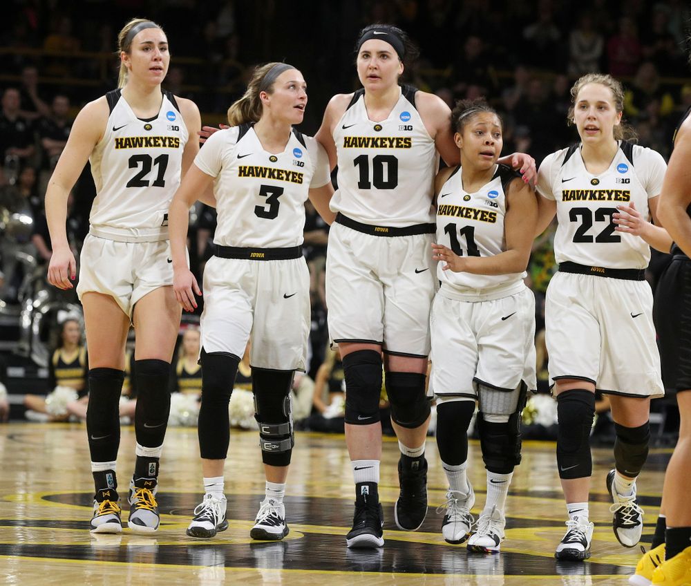 Iowa Hawkeyes forward Hannah Stewart (21), guard Makenzie Meyer (3), center Megan Gustafson (10), guard Tania Davis (11), and guard Kathleen Doyle (22) walk down the court together during the fourth quarter of their second round game in the 2019 NCAA Women's Basketball Tournament at Carver Hawkeye Arena in Iowa City on Sunday, Mar. 24, 2019. (Stephen Mally for hawkeyesports.com)