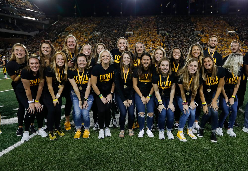 Members of the Iowa women's swimming and diving team are recognized by the Presidential Committee on Athletics at halftime during a game against Wisconsin on September 22, 2018. (Tork Mason/hawkeyesports.com)