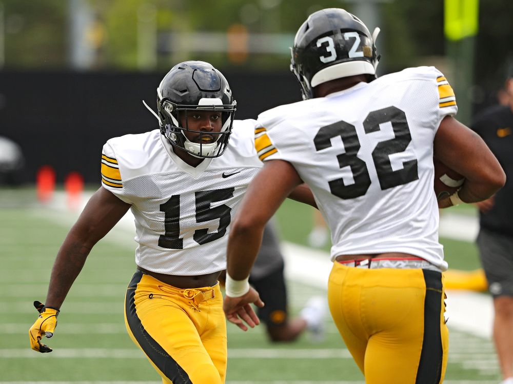 Iowa Hawkeyes defensive back Dallas Craddieth (15) closes in on linebacker Djimon Colbert (32) as they run a drill during Fall Camp Practice No. 10 at the Hansen Football Performance Center in Iowa City on Tuesday, Aug 13, 2019. (Stephen Mally/hawkeyesports.com)