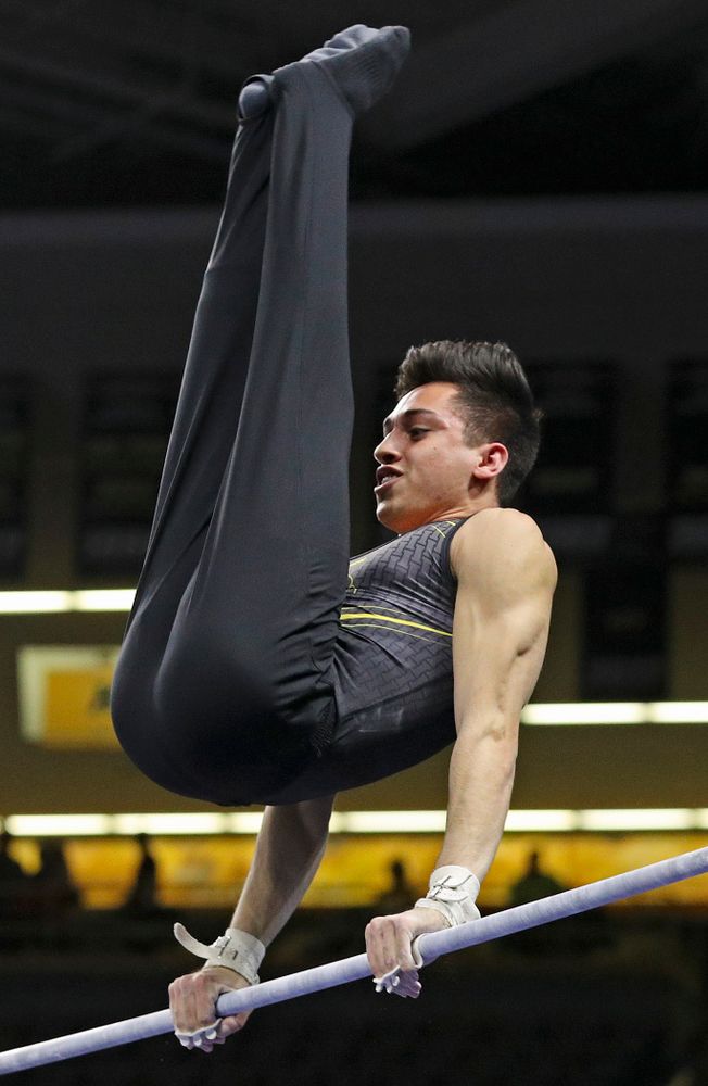 Iowa's Andrew Herrador competes in the horizontal bar during the first day of the Big Ten Men's Gymnastics Championships at Carver-Hawkeye Arena in Iowa City on Friday, Apr. 5, 2019. (Stephen Mally/hawkeyesports.com)