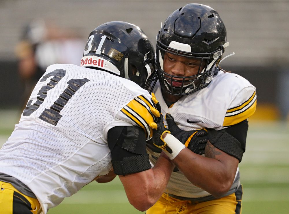 Iowa Hawkeyes linebacker Jack Campbell (from left) and linebacker Jestin Jacobs run a drill during Fall Camp Practice No. 12 at Kinnick Stadium in Iowa City on Thursday, Aug 15, 2019. (Stephen Mally/hawkeyesports.com)