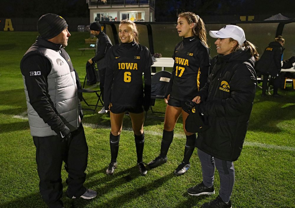 Iowa head coach Dave DiIanni talks with midfielder Isabella Blackman (6), defender Hannah Drkulec (17), and assistant coach Katelyn Longino before their match at the Iowa Soccer Complex in Iowa City on Friday, Oct 11, 2019. (Stephen Mally/hawkeyesports.com)