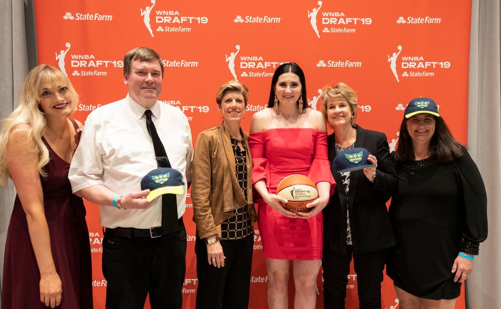 Iowa Hawkeyes forward Megan Gustafson (10) with head coach Lisa Bluder, associate head coach Jan Jensen and her family after being selected by the Dallas Wings in the second round of the 2019 WNBA Draft Wednesday, April 10, 2019 at Nike New York Headquarters in New York City. (Brian Ray/hawkeyesports.com)