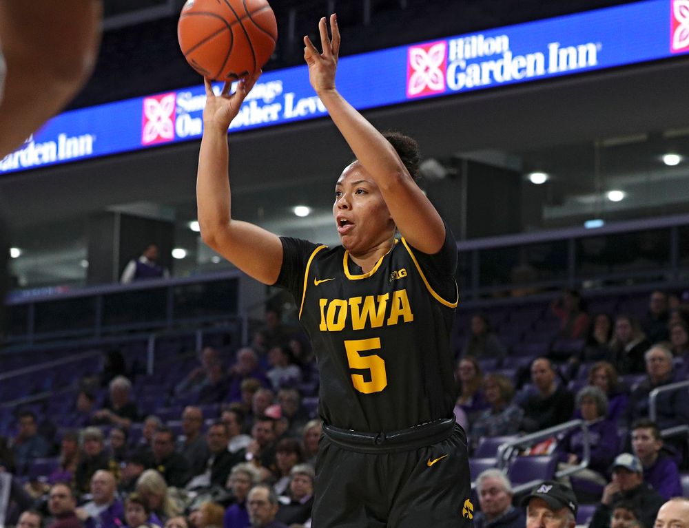 Iowa Hawkeyes guard Alexis Sevillian (5) makes a 3-pointer during the first quarter of their game at Welsh-Ryan Arena in Evanston, Ill. on Sunday, January 5, 2020. (Stephen Mally/hawkeyesports.com)