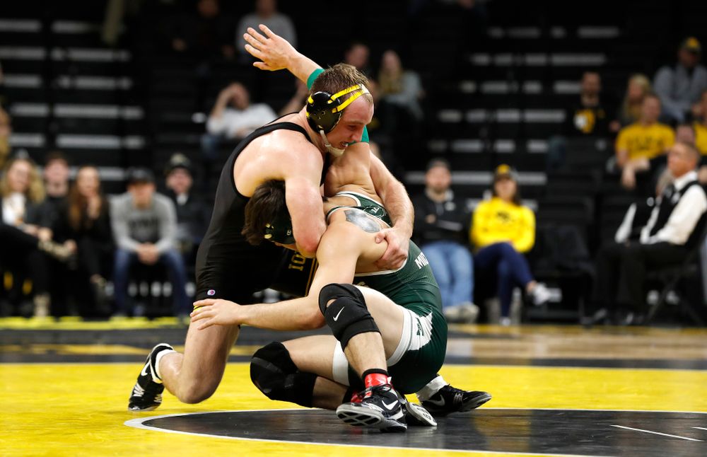 Iowa's Alex Marinelli tech falls Michigan State's Austin Hiles at 165 pounds.