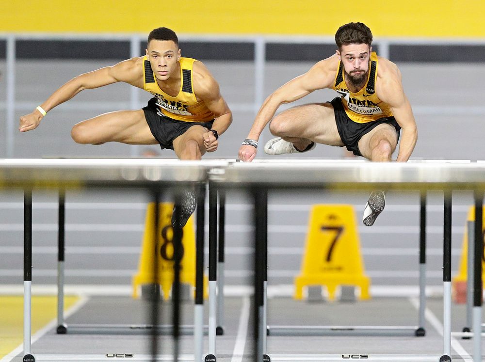Iowa’s Jamal Britt (from left) and Josh Braverman run in the men’s 60 meter hurdles prelim event during the Hawkeye Invitational at the Recreation Building in Iowa City on Saturday, January 11, 2020. (Stephen Mally/hawkeyesports.com)