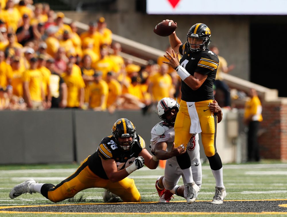 Iowa Hawkeyes quarterback Nate Stanley (4) completes a pass under pressure against the Northern Illinois Huskies Saturday, September 1, 2018 at Kinnick Stadium. (Brian Ray/hawkeyesports.com)