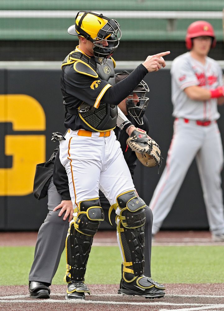 Iowa Hawkeyes catcher Austin Martin (34) points to pitcher Trenton Wallace (not pictured) after a strikeout during the second inning of their game against Illinois State at Duane Banks Field in Iowa City on Wednesday, Apr. 3, 2019. (Stephen Mally/hawkeyesports.com)