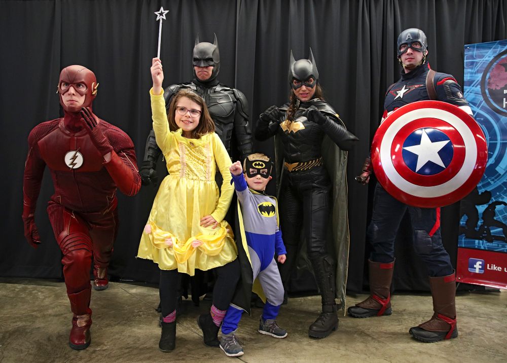 Two fans get a picture with a group of superheroes on Superhero and Princess Day before the meet at Carver-Hawkeye Arena in Iowa City on Sunday, March 8, 2020. (Stephen Mally/hawkeyesports.com)